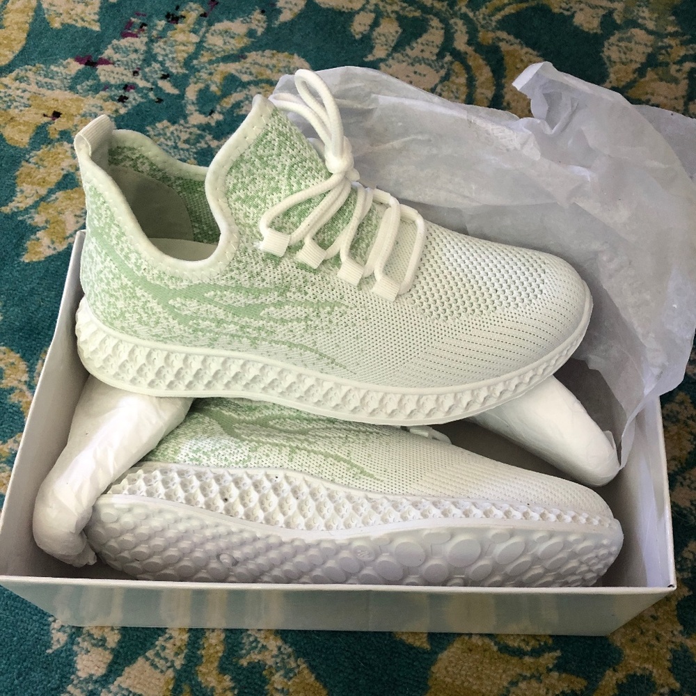 Green and white sneakers